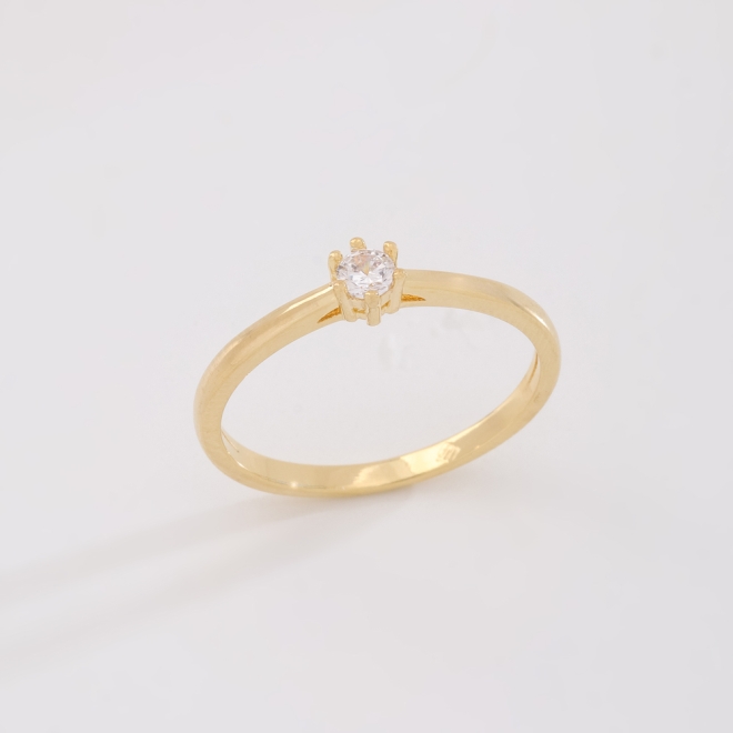 AS-0007 ANEL BANHADO A OURO 18K COM ZIRCÔNIA CENTRAL EM FORMATO REDONDO