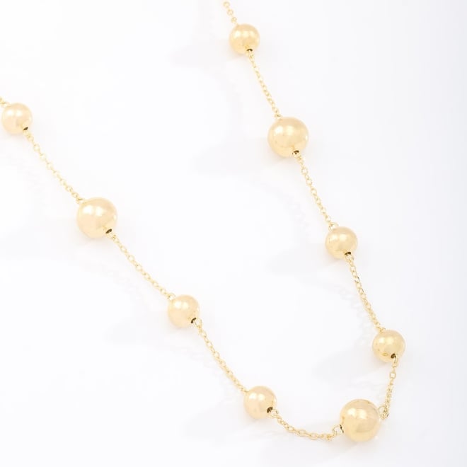 GR-02052 GARGANTILHA BANHADA A OURO 18K COM ESFERAS EM TAMANHOS VARIADOS.