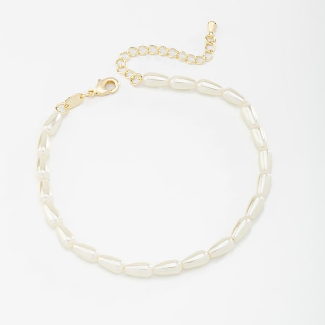 PU-00680 PULSEIRA BANHADA A OURO 18K COM P&Eacute;ROLAS EM FORMATO ALONGADO