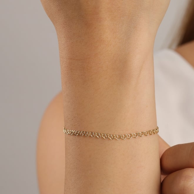 PU-01018 PULSEIRA BANHADA A OURO 18K COM ELOS  DE CORAÇÃO ENTRELAÇADOS