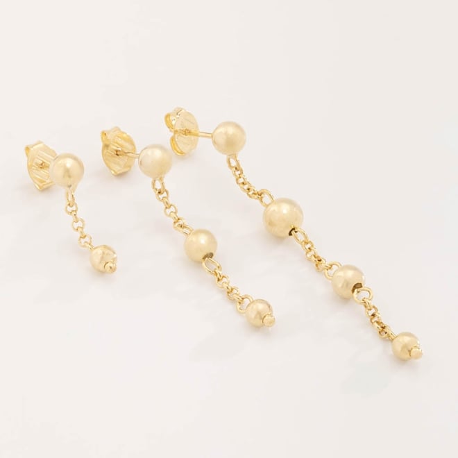 TBR-00021 TRIO DE BRINCOS BANHADOS A OURO 18K COM ESFERAS POLIDAS E CORRENTES