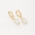 AQ-00243 BRINCO BANHADO A OURO 18K EM FORMATO DE ARGOLA COM DETALHES EM ESFERAS