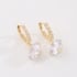 AQ-00273-ARGOLA COM ZIRCÔNIAS CRAVEJADAS E PINGENTE EM ZIRCÔNIA REDONDA LAPIDADA