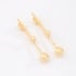 BR-00507 BRINCO BANHADO A OURO 18K  ALONGADA COM  ESFERAS
