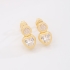 BR-00804 BRINCO BANHADO A OURO 18K COM PEDRAS EM FORMATO REDONDO E CORAÇÃO