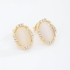 BR-02756 BRINCO COM PEDRA OVAL EM TONS PEROLADOS