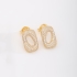 BR-02856-BRINCO BANHADO A OURO 18K EM FORMATO OVAL VAZADO