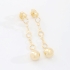 BR-03013 BRINCO BANHADO A OURO 18K COM DETALHES EM CRISTAIS REDONDOS E ESFERA NA PONTA