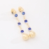 BR-03013 BRINCO BANHADO A OURO 18K COM DETALHES EM CRISTAIS REDONDOS E ESFERA NA PONTA