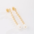 BR-03048 BRINCO BANHADO A OURO 18K COM DESIGN ALONGADO EM ESFERAS POLIDAS