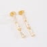 BR-03150-BRINCO BANHADO A OURO 18K COM DESIGN LONGO EM TRAPÉZIO DE  ZIRCÔNIAS BAGUETE