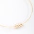 CH-0337 CHOKER DE ARO BANHADA A OURO 18K COM DETALHE CENTRAL EM PÉROLAS.