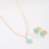 CI-00097-CONJUNTO INFANTIL COM ESTRELA-DO-MAR ESMALTADA