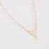 GI-00127 GARGANTILHA INFANTIL BANHADA A OURO 18K COM DETALHES EM PÉROLAS E PINGENTE DE NOSSA SENHORA APARECIDA