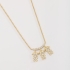 GR-01110 COLAR BANHADO A OURO 18K COM TRÊS PINGENTES DE MENINA CRAVEJADOS EM ZIRCÔNIAS
