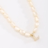 GR-02101 COLAR BANHADO A OURO 18K COM PÉROLAS BARROCAS E PINGENTE DE LETRA CRAVEJADO EM ZIRCÔNIAS