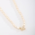 GR-02101 COLAR BANHADO A OURO 18K COM PÉROLAS BARROCAS E PINGENTE DE LETRA CRAVEJADO EM ZIRCÔNIAS