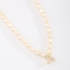 GR-02101 COLAR BANHADO A OURO 18K COM PÉROLAS BARROCAS E PINGENTE DE LETRA CRAVEJADO EM ZIRCÔNIAS