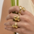 AN-01233 ANEL BANHADO A OURO 18K COM DESIGN ORGÂNICO E ACABAMENTO POLIDO