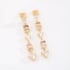 OUTB-14880 BRINCO BANHADO A OURO 18K COM PEDRAS LAPIDADAS EM FORMATO TRILLION E OVAIS