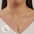 PG-00085 PINGENTE BANHADO A OURO 18K DE MENINO COM CORAÇÃO CRAVEJADO.