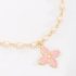 PI-00104 PULSEIRA COM DETALHES EM PÉROLAS E PINGENTE DE FLOR