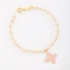 PI-00104 PULSEIRA COM DETALHES EM PÉROLAS E PINGENTE DE FLOR