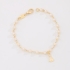 PI-00121-PULSEIRA INFANTIL COM DETALHES EM PÉROLAS E PINGENTE DE NOSSA SENHORA APARECIDA