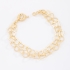 PU-00112 PULSEIRA COM ELOS ENTRELAÇADOS EM CORAÇÃO