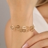 PU-00112 PULSEIRA COM ELOS ENTRELAÇADOS EM CORAÇÃO