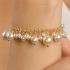 PU-00254 PULSEIRA BANHADA A OURO 18K COM CORRENTE DELICADA E PÉROLAS