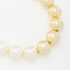 PU-00752 PULSEIRA COM PÉROLAS BRANCAS E ESFERAS DOURADAS
