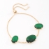 PU-00911 PULSEIRA BANHADA A OURO 18K COM TRÊS PEDRAS DE ZIRCÔNIA EM FORMATO OVAL E FECHO AJUSTÁVEL