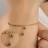 PU-00933 PULSEIRA BANHADA A OURO 18K COM ESFERAS  E DETALHE DE PINGENTE DELICADO