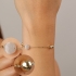 PU-00968 PULSEIRA BANHADA A OURO 18K COM ESFERAS POLIDAS E PEDRAS LEITOSAS