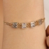 PU-01013 PULSEIRA COM ZIRCÔNIAS EM FORMATO BAGUETE E FECHO REGULÁVEL