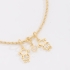 PU-01029-PULSEIRA BANHADA A OURO 18K COM PINGENTES DE DUAS MENINAS E CORAÇÃO CRAVEJADO EM ZIRCÔNIAS