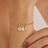 PU-01038 -PULSEIRA BANHADA A OURO 18K COM ELOS TRABALHADOS E PINGENTES DE SÃO BENTO