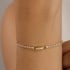 PU-01049 PULSEIRA RIVIERA COM ZIRCÔNIAS CRAVEJADAS E DETALHE CENTRAL EM GOTA