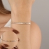 PX-0009 PULSEIRA BANHADA A OURO 18K COM ZIRCÔNIAS BAGUETE CRAVEJADAS