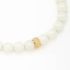 PX-0071 PULSEIRA BANHADA A OURO 18K COM PÉROLAS E DETALHE CENTRAL EM ZIRCÔNIAS