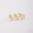 TBF-00015 TRIO DE BRINCOS BANHADOS A OURO 18K COM PEDRAS EM FORMATO DE CORAÇÃO