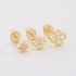 TBR-00041TRIO DE BRINCOS BANHADOS A OURO 18K COM DESIGN EM FORMATO DE FLOR