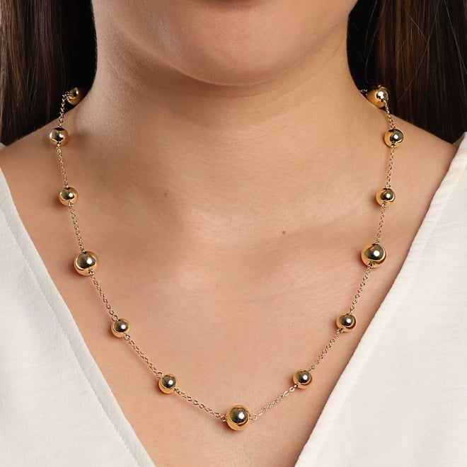 GR-02052 GARGANTILHA BANHADA A OURO 18K COM ESFERAS EM TAMANHOS VARIADOS.