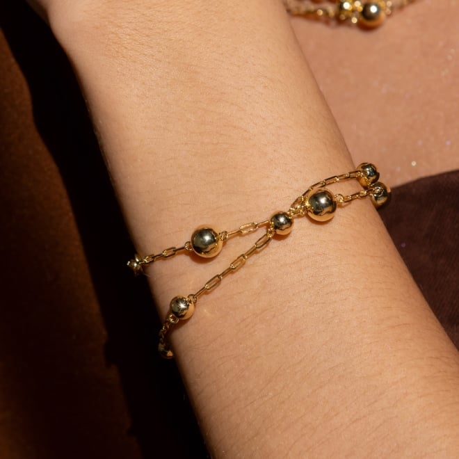 PU-00975 PULSEIRA BANHADA A OURO 18K COM ESFERAS E ELOS ALONGADOS