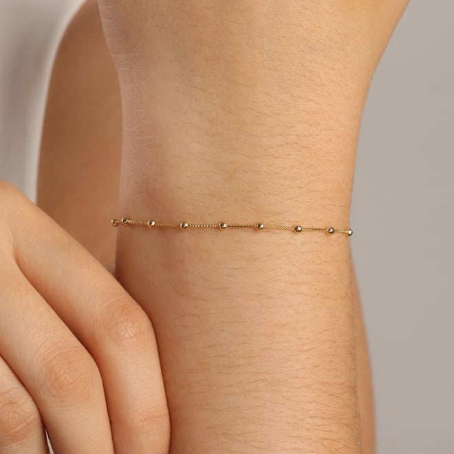 KPI-0017 PULSEIRA BANHADA A OURO 18K COM ESFERAS