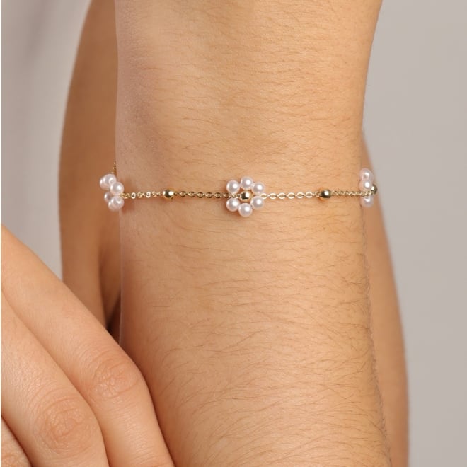 PI-00107 PULSEIRA COM DETALHES DE FLORES FORMADAS POR PÉROLAS E ESFERAS