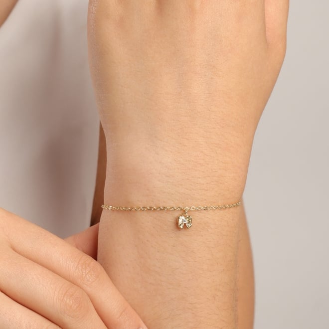 PI-00108 PULSEIRA COM PINGENTE EM FORMATO DE LAÇO EM ZIRCÔNIA