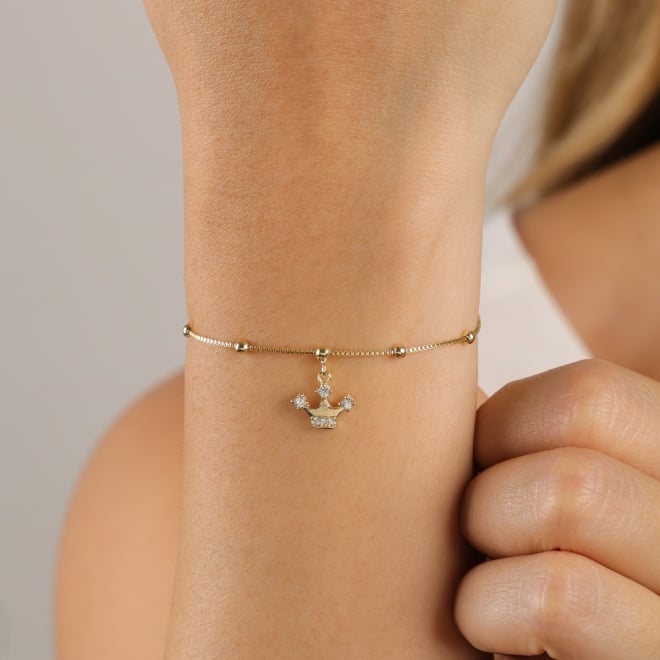 PU-00100-PULSEIRA COM ESFERAS E PINGENTE DE COROA