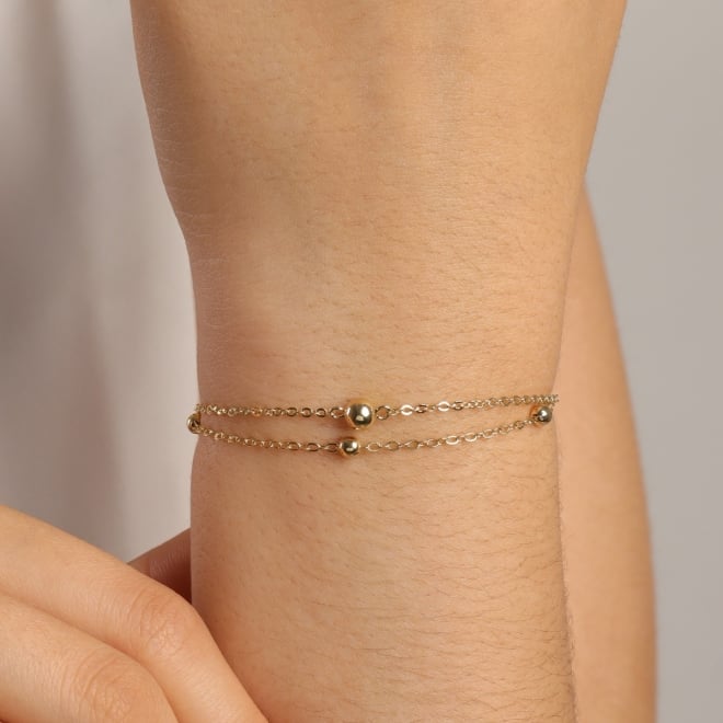 PU-00492 PULSEIRA COM DUAS CORRENTES E DETALHES EM ESFERAS